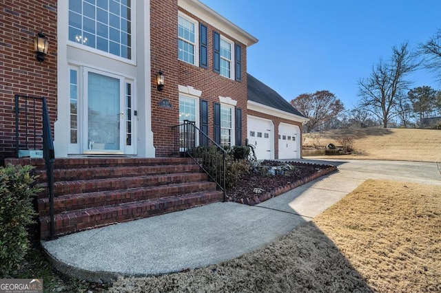 view of exterior entry with a garage