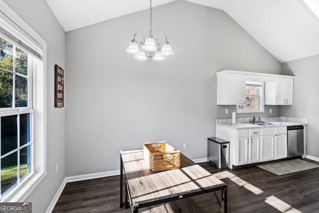 dining room featuring dark hardwood / wood-style flooring, plenty of natural light, and sink