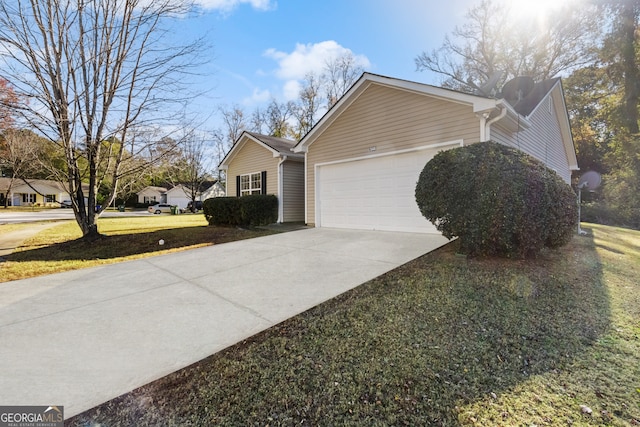 view of property exterior with a lawn and a garage