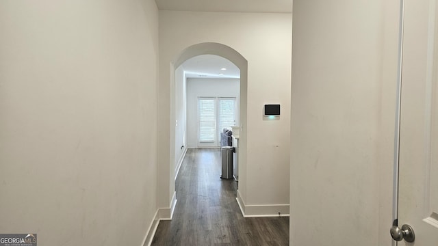 corridor featuring dark hardwood / wood-style flooring