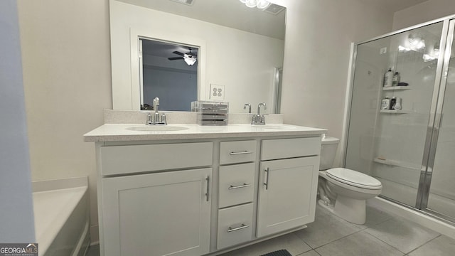 full bathroom featuring vanity, ceiling fan, tile patterned flooring, shower with separate bathtub, and toilet