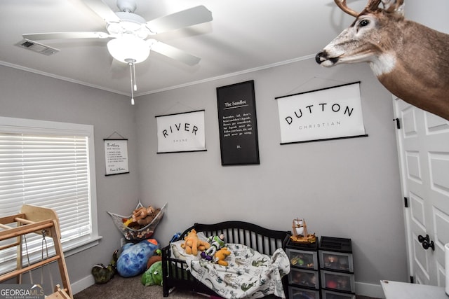 carpeted bedroom with ceiling fan, ornamental molding, visible vents, and baseboards