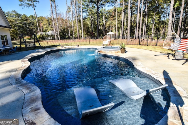 view of pool featuring a patio area, fence, and a fenced in pool