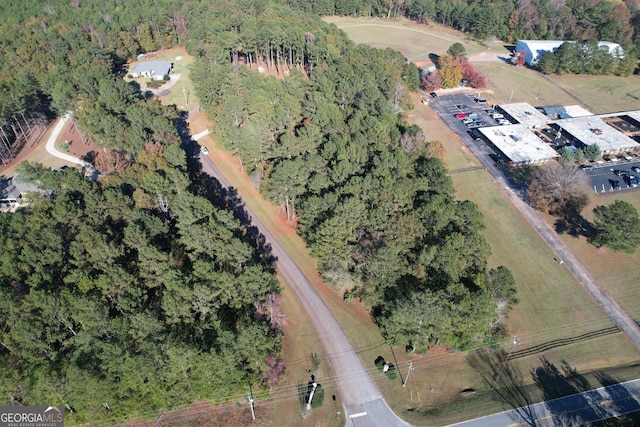 drone / aerial view with a view of trees