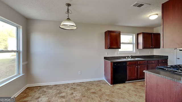 kitchen featuring dishwasher, sink, gas stovetop, pendant lighting, and a textured ceiling