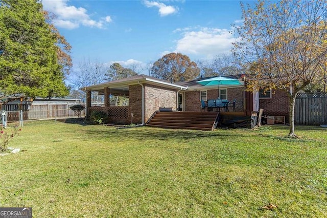 view of yard featuring a deck