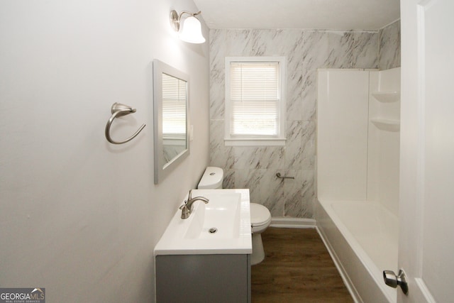 bathroom with vanity, hardwood / wood-style flooring, and toilet