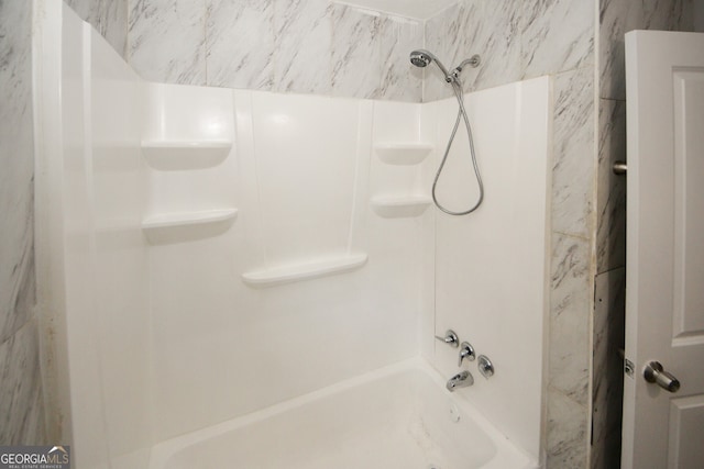 bathroom with shower / bath combination