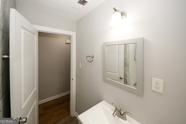 bathroom featuring hardwood / wood-style floors