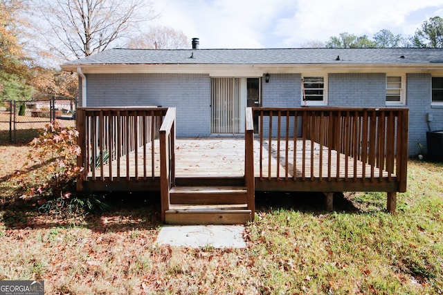 back of house with a deck