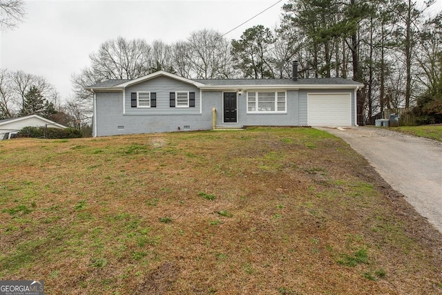 single story home featuring a garage and a front lawn