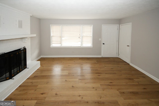 unfurnished living room featuring light hardwood / wood-style flooring