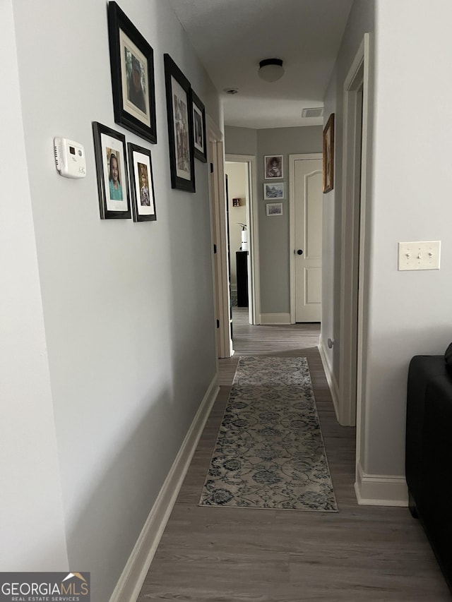 hall featuring dark wood-type flooring