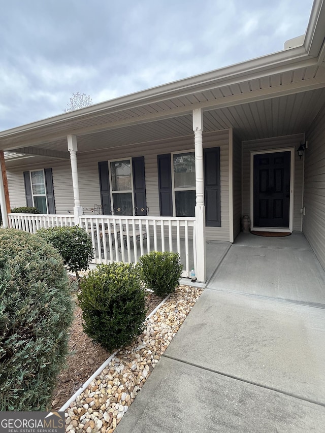 doorway to property with a porch