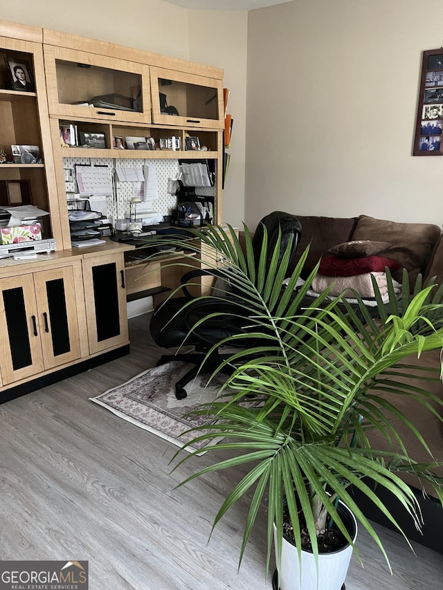 home office with wood finished floors