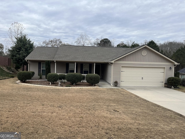 ranch-style house featuring a shingled roof, covered porch, an attached garage, a front yard, and driveway