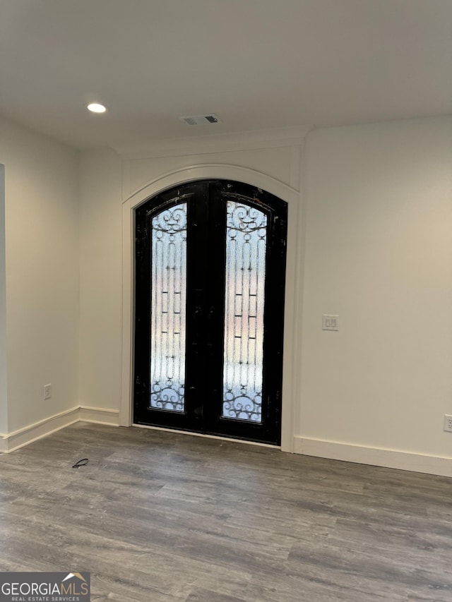 entrance foyer featuring hardwood / wood-style flooring