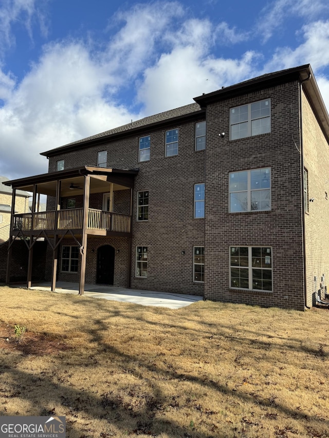 rear view of property with a patio area, ceiling fan, and a deck