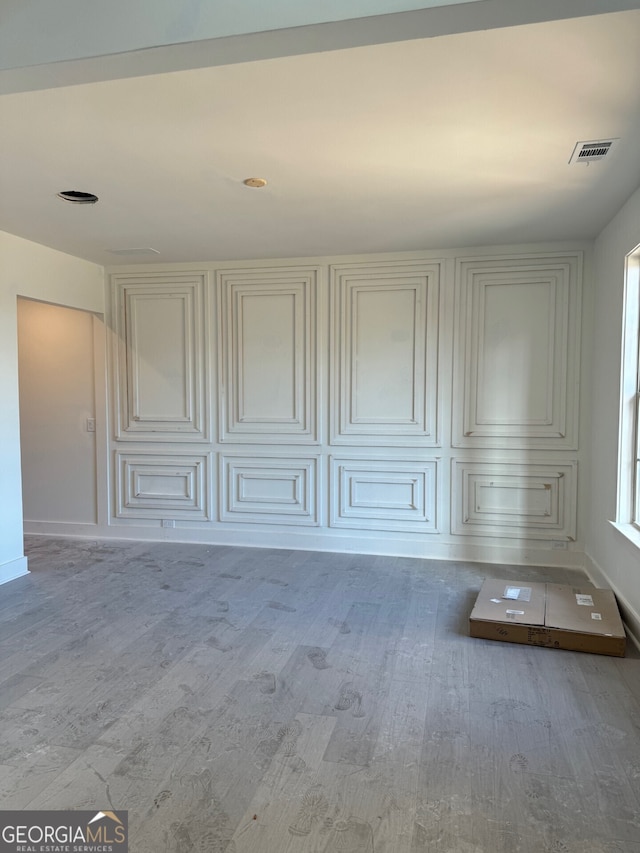 empty room with wood-type flooring