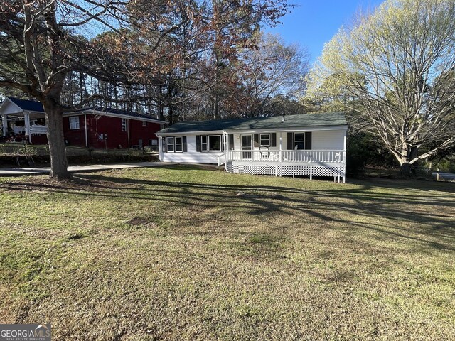 single story home featuring covered porch