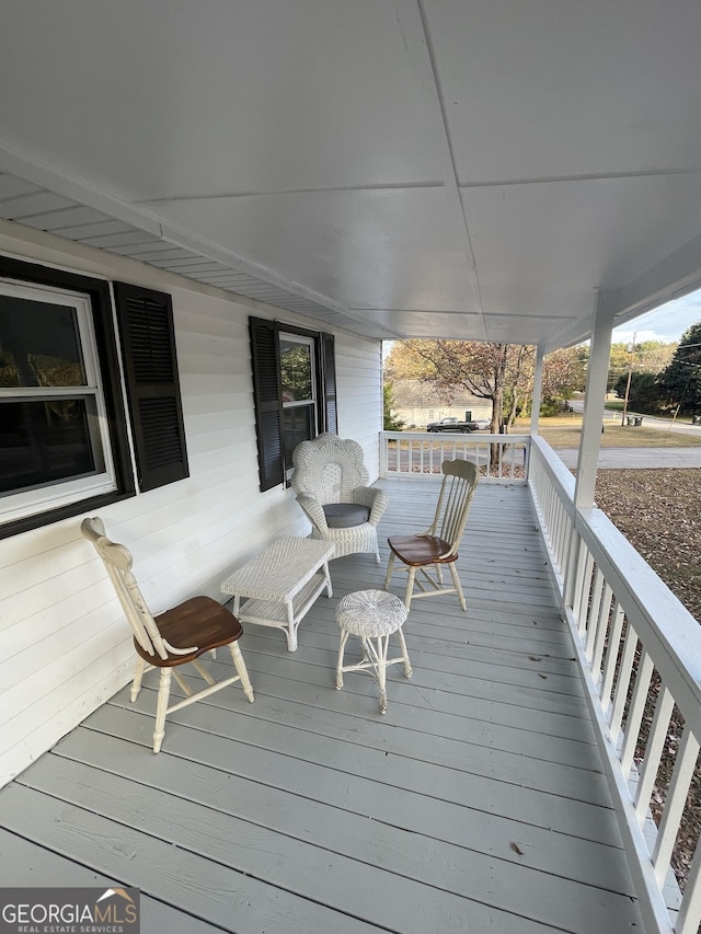 wooden deck featuring a porch