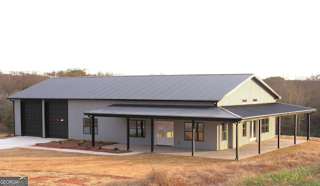 view of front of house with a porch and a garage