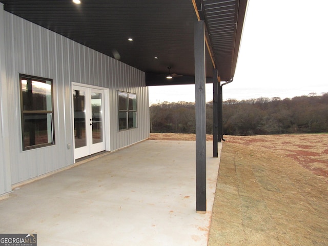 view of patio / terrace featuring ceiling fan and french doors