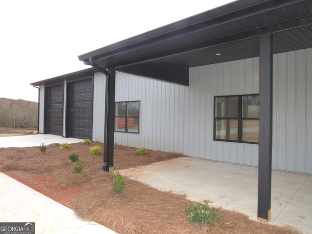 view of side of home featuring a garage