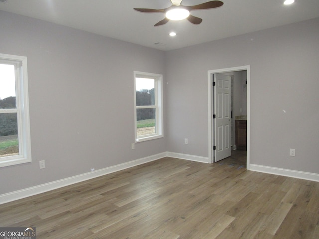 unfurnished room with light hardwood / wood-style flooring and ceiling fan