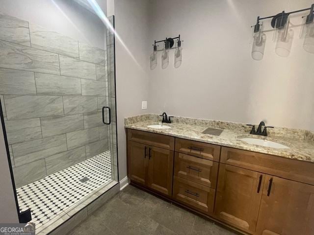 bathroom with tile patterned flooring, vanity, and walk in shower