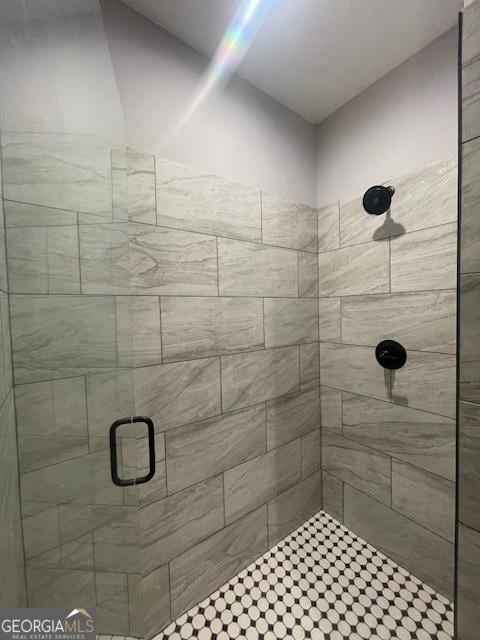 bathroom with a shower with shower door