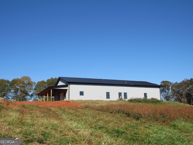 view of home's exterior featuring an outdoor structure