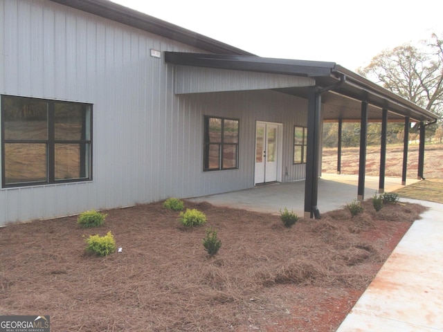 view of side of property featuring a patio area