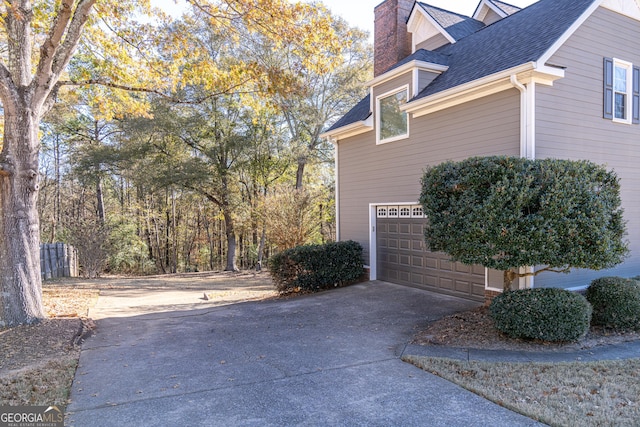 view of property exterior featuring a garage