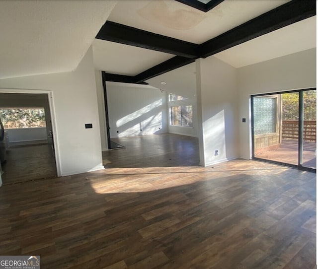 interior space featuring a wealth of natural light, lofted ceiling with beams, and dark hardwood / wood-style floors