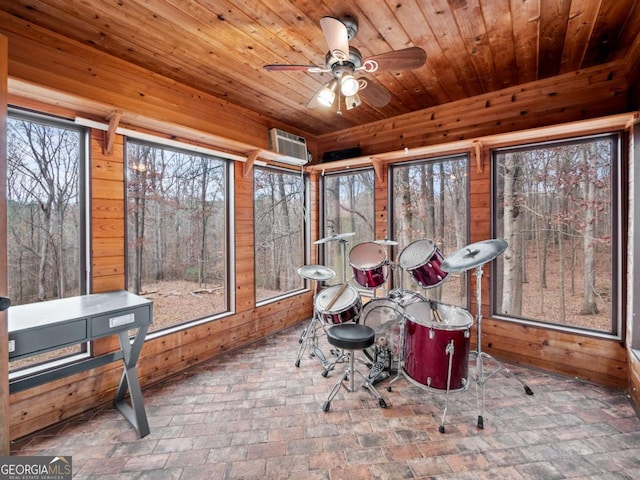 sunroom featuring wooden ceiling and ceiling fan