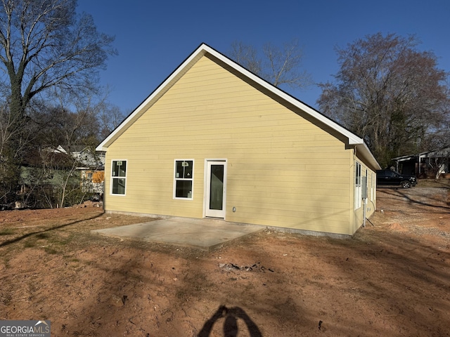 rear view of property featuring a patio area