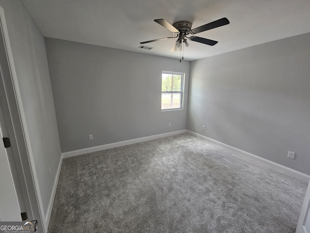 carpeted empty room with ceiling fan