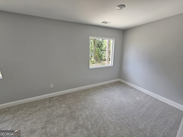 unfurnished room featuring carpet flooring