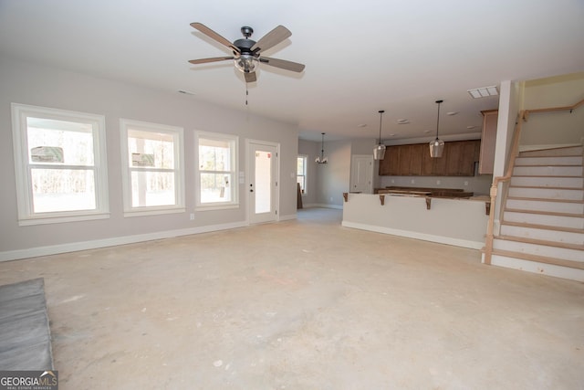 unfurnished living room featuring ceiling fan