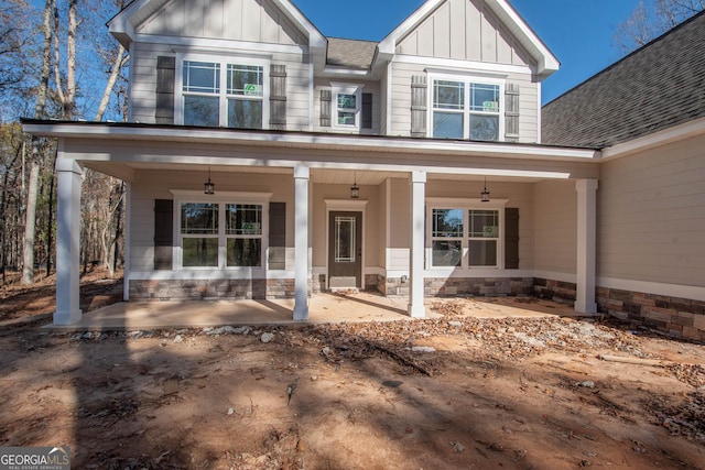 view of front of home featuring covered porch and board and batten siding