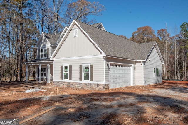 view of side of home featuring a garage