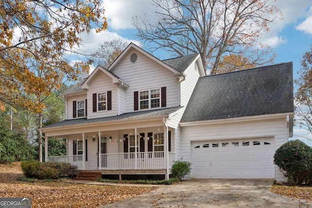 view of front of house with covered porch and a garage