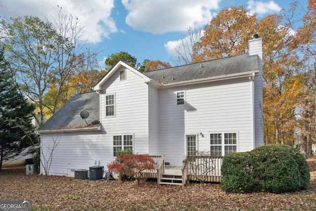 back of property featuring central air condition unit and a wooden deck