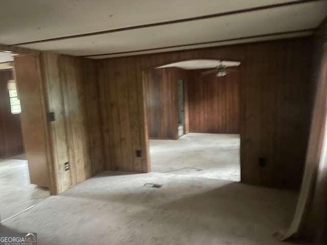 empty room with wood walls