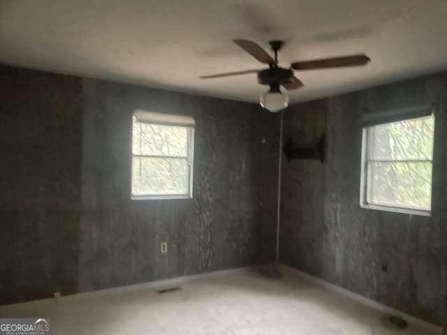 spare room with ceiling fan