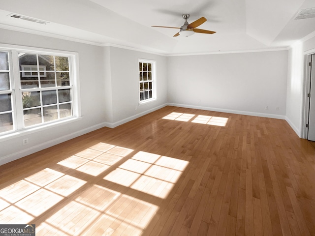 spare room featuring ceiling fan, hardwood / wood-style floors, and crown molding