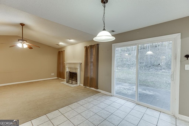 unfurnished living room with a textured ceiling, light colored carpet, ceiling fan, and lofted ceiling