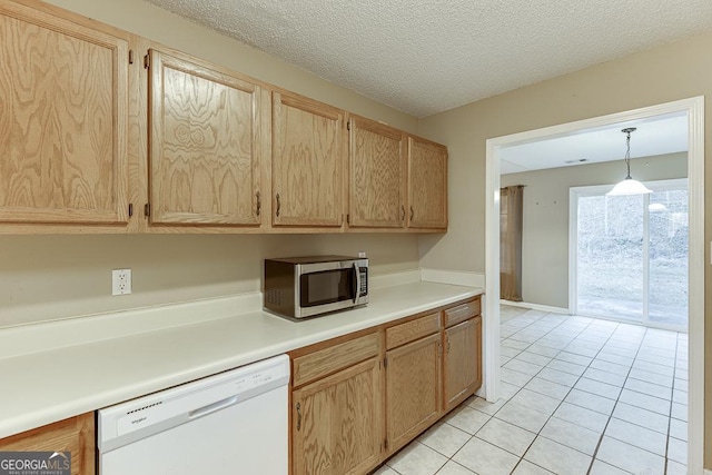 kitchen with light brown cabinets, white dishwasher, pendant lighting, a textured ceiling, and light tile patterned floors