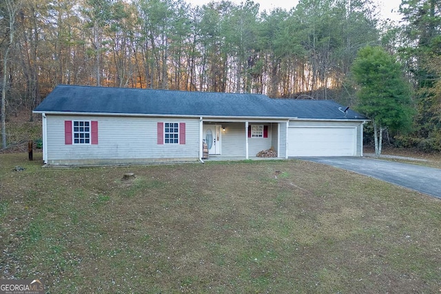 single story home with a front yard, a garage, and covered porch